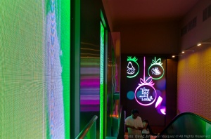 Massive walls of electronic  projection frame the entry environment in Waikiki's Galleria.