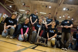 STEM Expo Robotics team takes a break from their demonstration for a group photo. Teamwork builds confidence and trust in the students themselves as well as other team members.