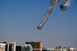 A photo illustration of space debris from a low Earth orbit reentering the atmosphere over a city. Earth has water covering 70% of its surface — when attempts fail to guide space debris towards open oceans, the chance for these falling objects to hit a populated area increase. Space Law sets the liability for damages caused by the space debris to the nation or agency responsible responsible to its original rocket launch.