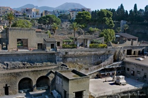Julius Caesar's father-in-law residence - Villa of Papyri is located at Herculanieum, which was buried along with the city of Pompei, by the volcano Vesuvius, seen in the upper top frame.